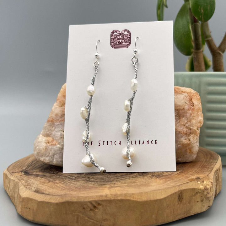 white freshwater pearl dangle earrings sterling silver on white card