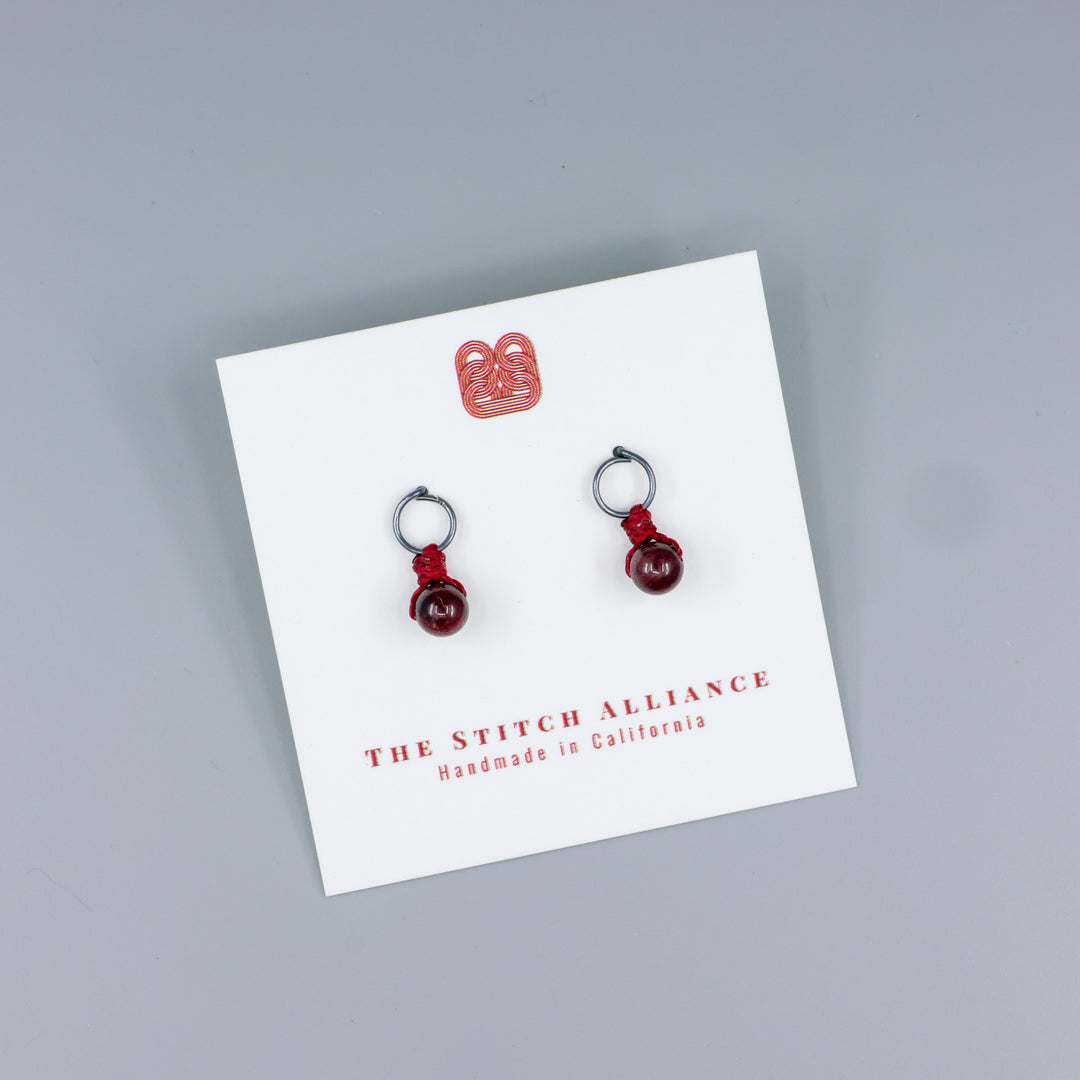 garnet mini dangle earrings oxidized sterling silver handmade on a white card