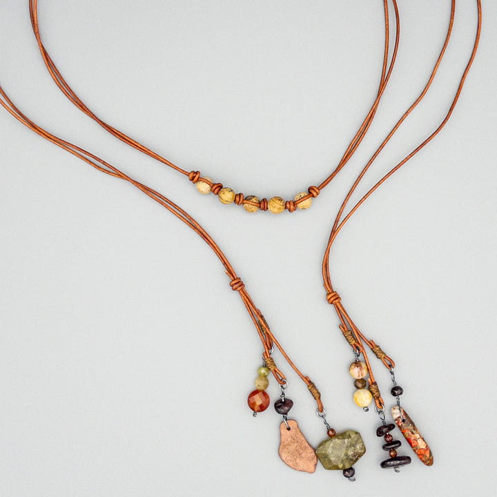 Gemstone leather lariat necklace on gray background