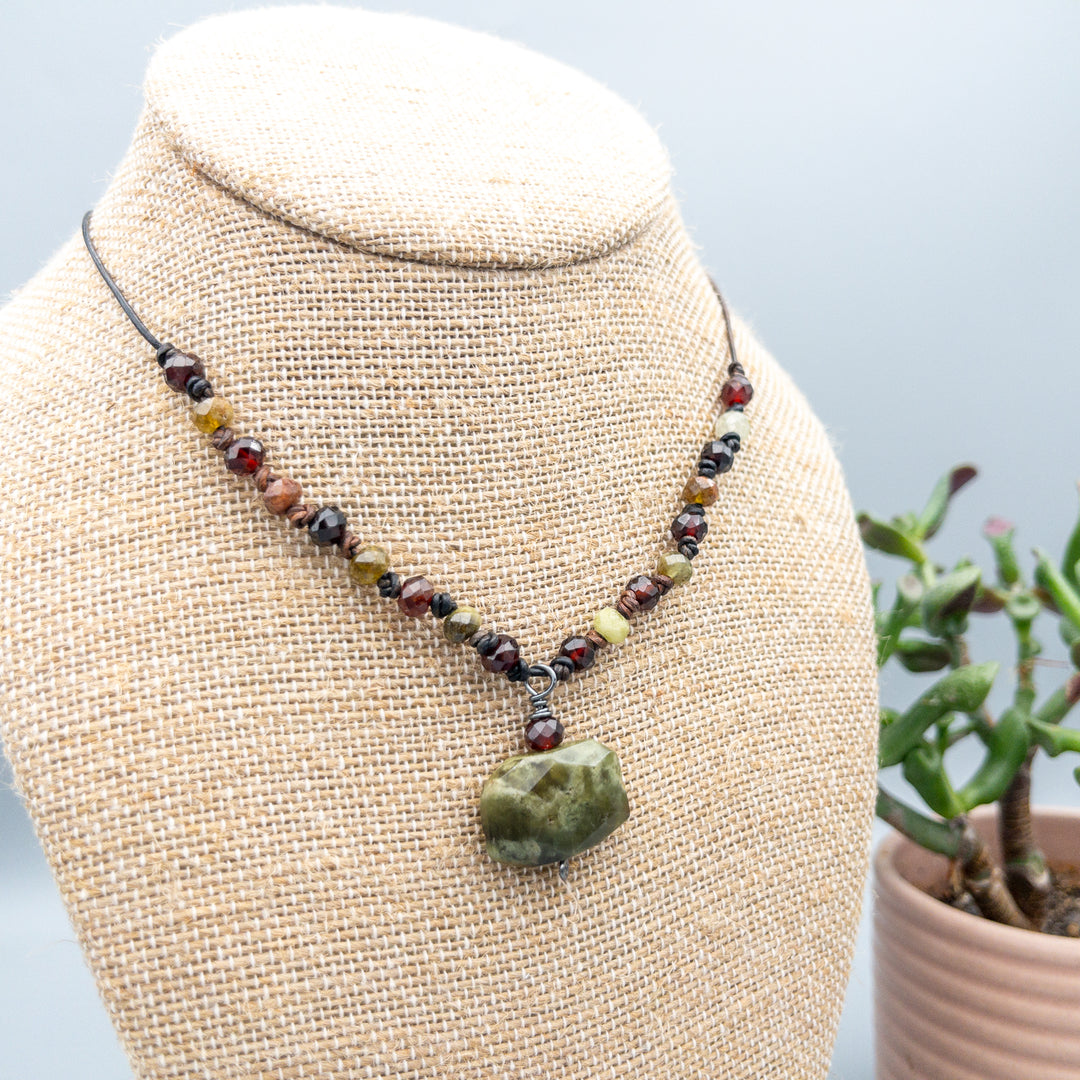 Green and red garnet leather knotted necklace