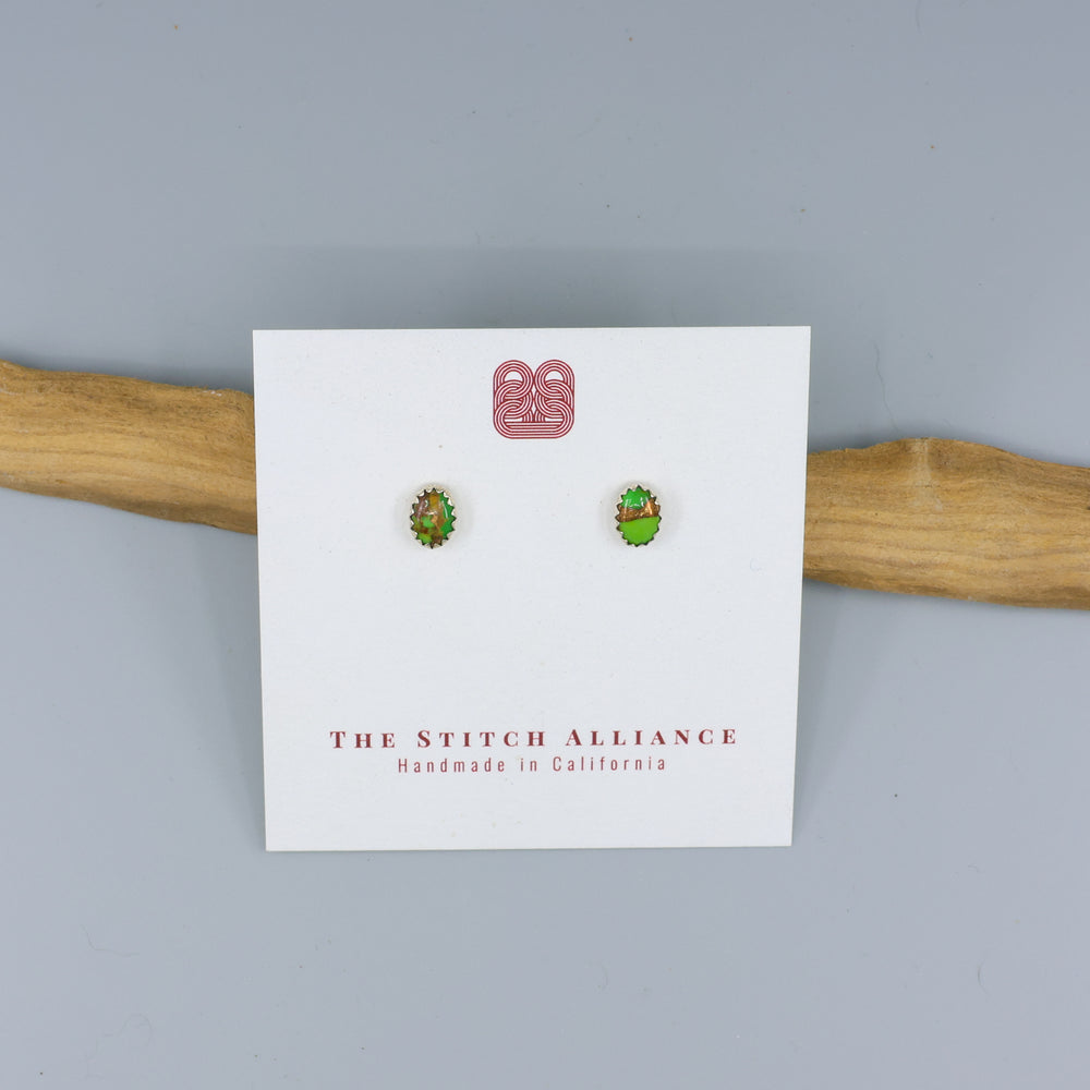 green copper turquoise stud earrings on a white card