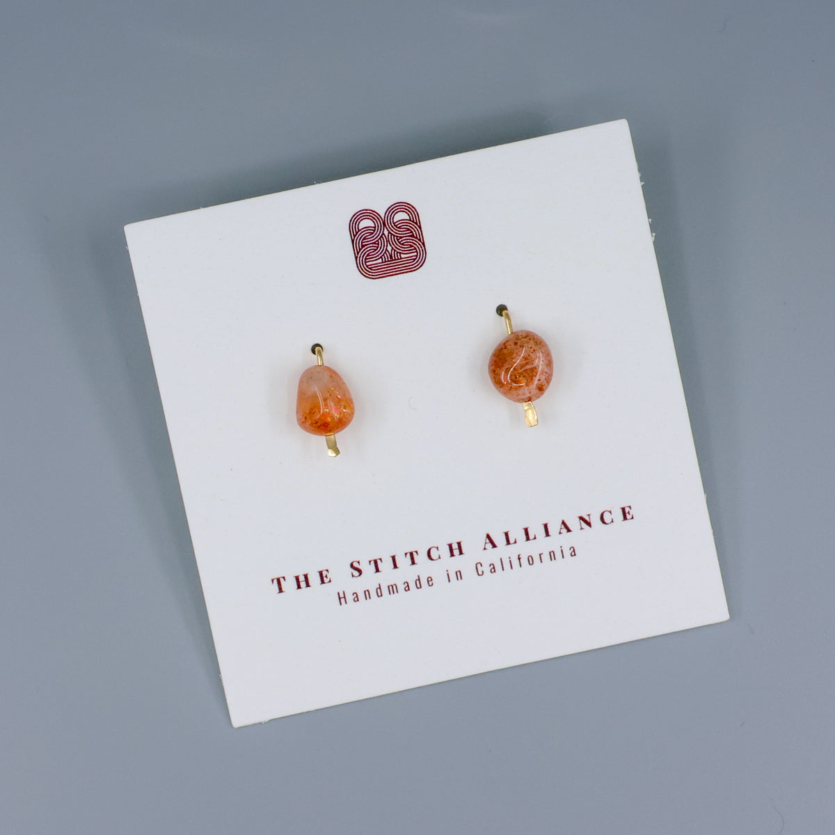 handmade sunstone gold fill stud earrings on a white card