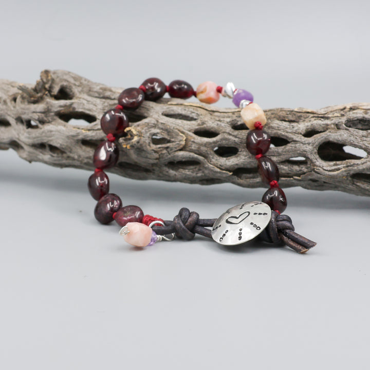 heart stamp bracelet with garnet, amethyst, and pink opal beads