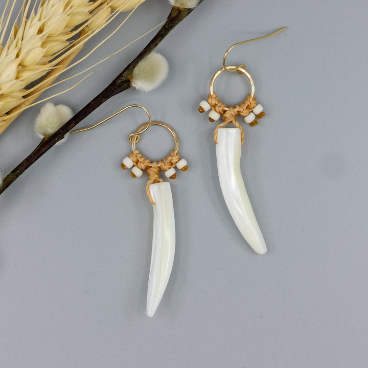 Mother of Pearl and gold fill statement earrings on a gray background