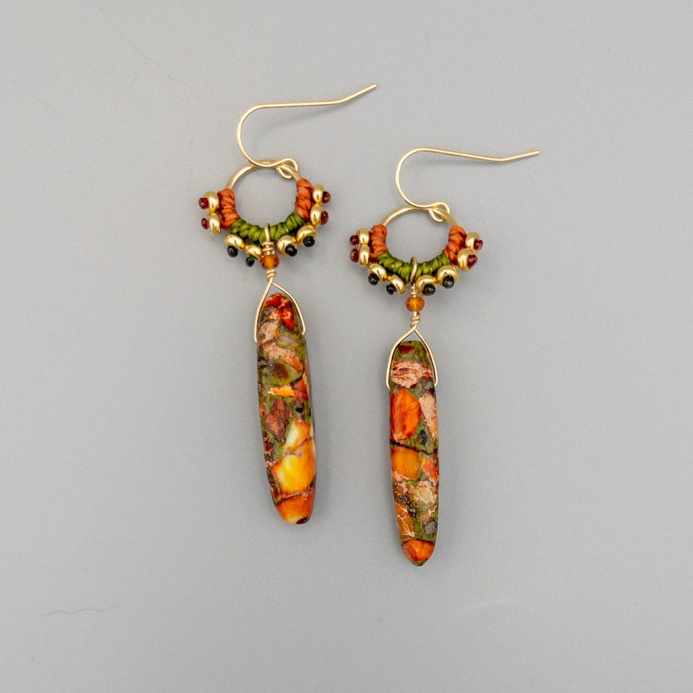 red creek jasper gold fill dangle earrings on a gray backgorund