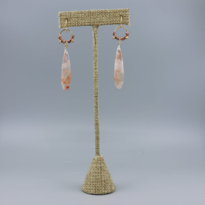 cherry blossom agate handmade macrame hoop earrings in gold fill on a linen display hanger