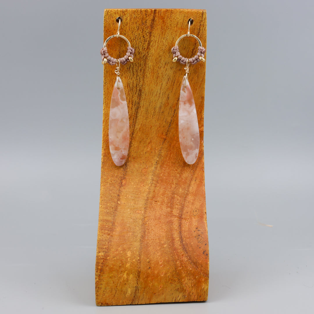 cherry blossom agate handmade macrame hoop earrings in gold fill on a wood display
