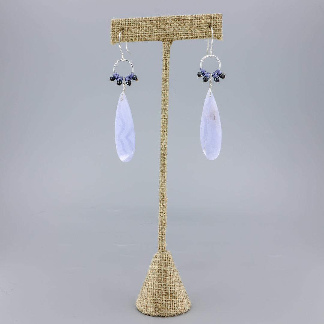 handmade, sterling silver and blue lace agate dangle earrings on a linen hanger