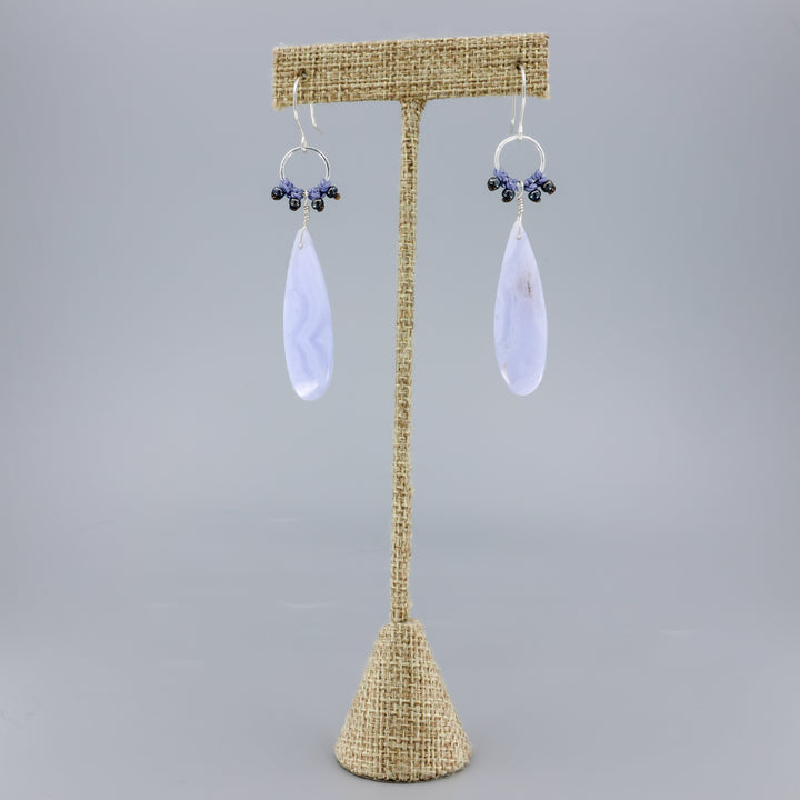 handmade, sterling silver and blue lace agate dangle earrings on a linen hanger