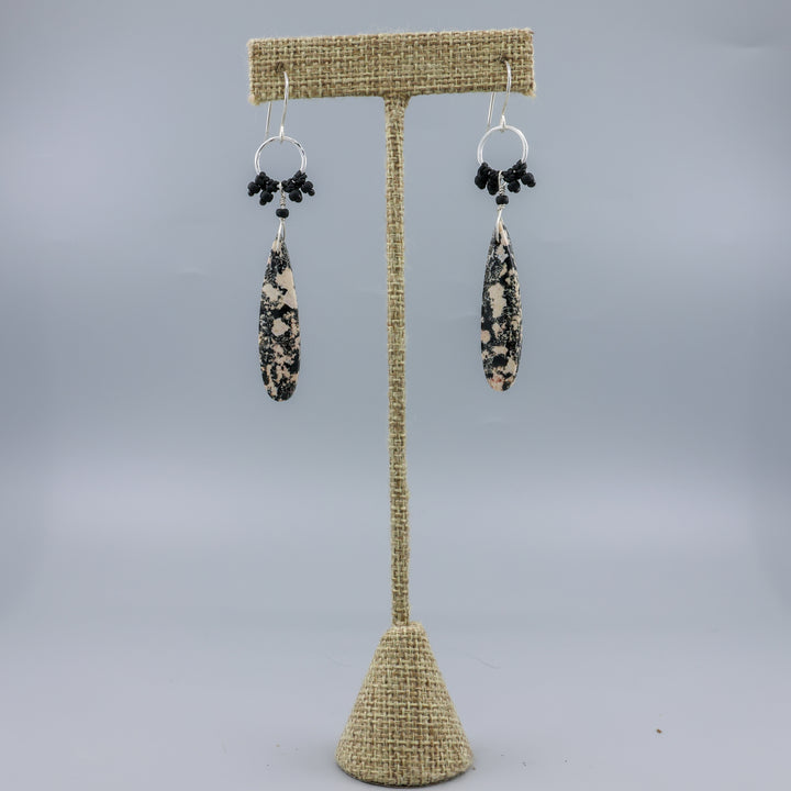 handmade snowflake obsidian sterling silver macrame earrings on a linen hanger