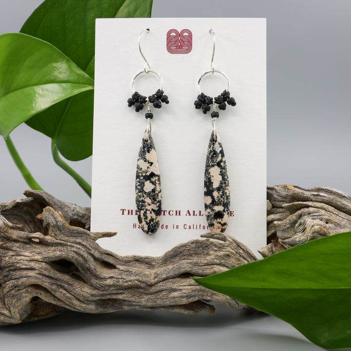 handmade snowflake obsidian sterling silver macrame earrings on a white card