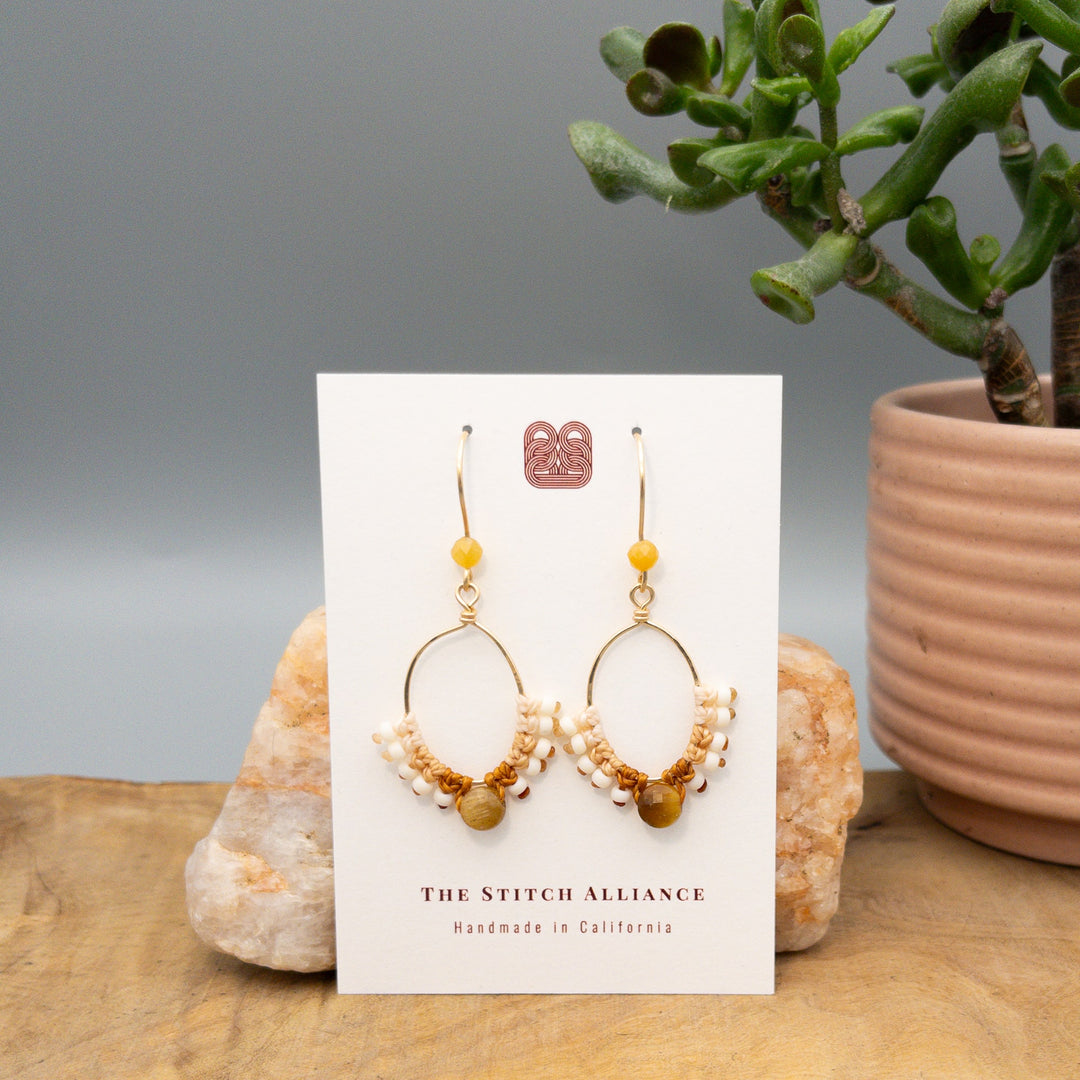 gold filled hoop earrings macrame with golden tiger eye faceted beads on a white card