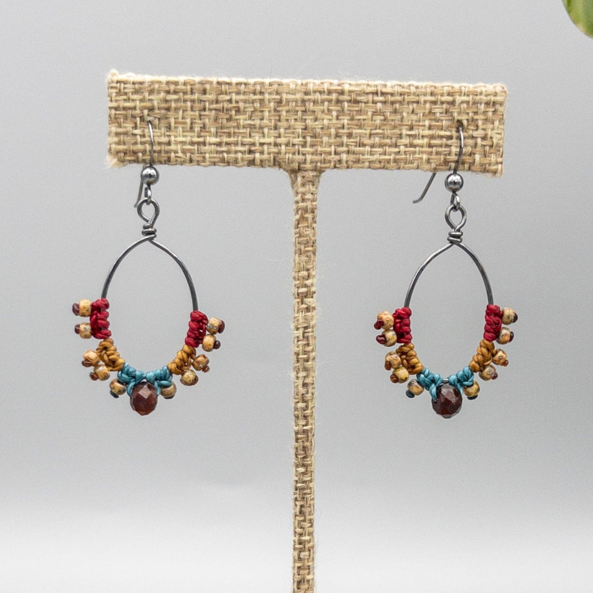 handmade macrame hoop earrings with garnet bead