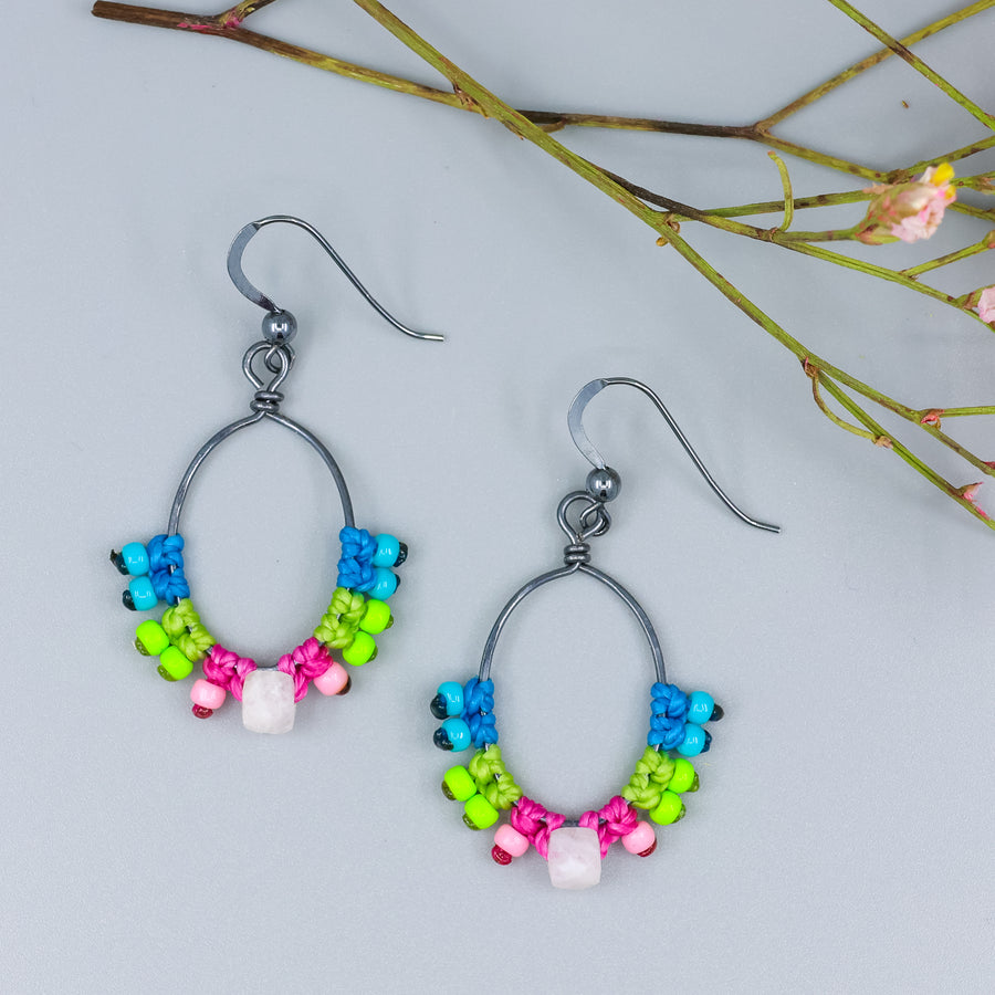 handmade macrame hoop earrings in oxidized sterling silver with bright colors and rainbow moonstone bead