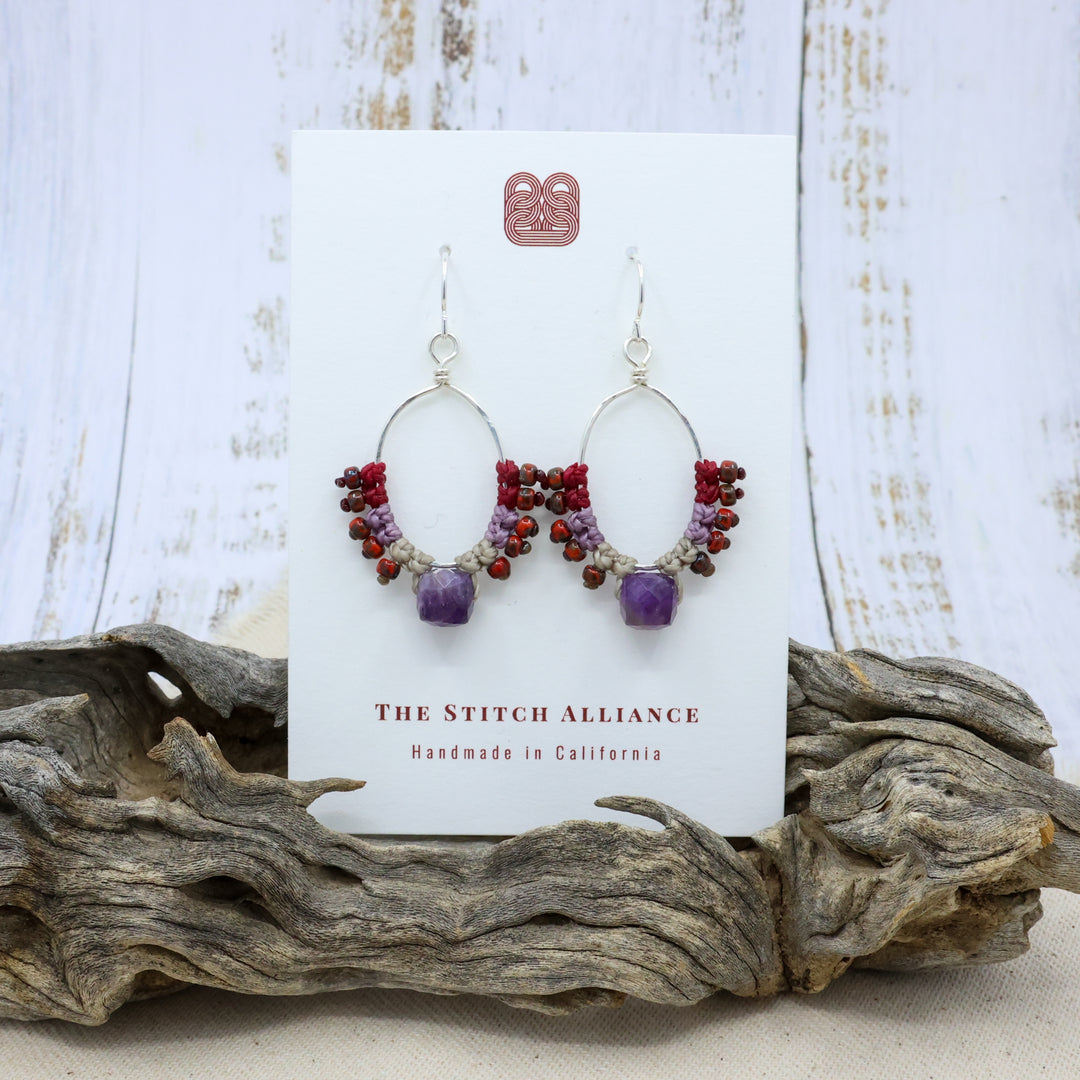 handmade sterling silver and amethyst hoop earrings with macrame on a white card