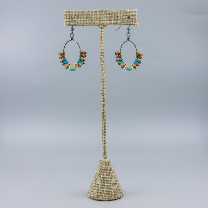 turquoise macrame hoop earrings on linen hanger