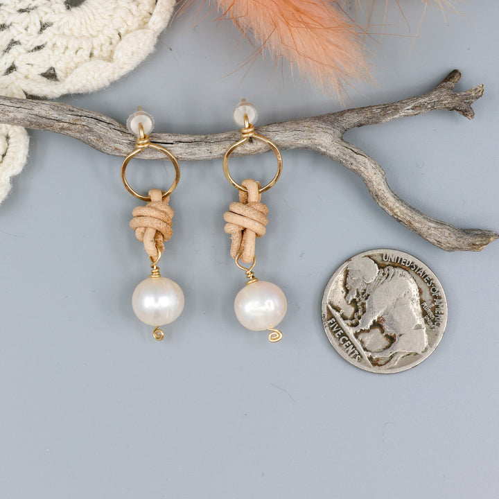 freshwater pearl, leather, and gold fill handmade earrings with a nickel for size comparison