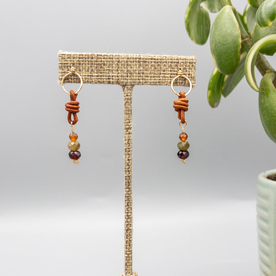 handmade garnet, green garnet, and hessonite gold filled earring with leather