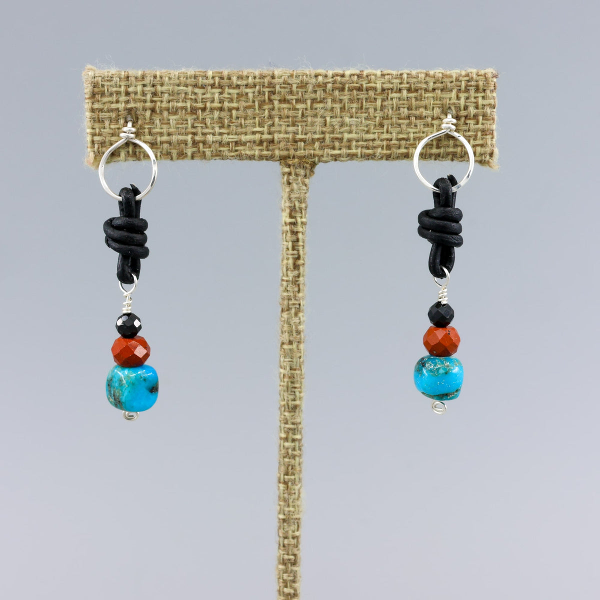 turquoise, poppy jasper, and spinel leather knotted earrings with sterling silver