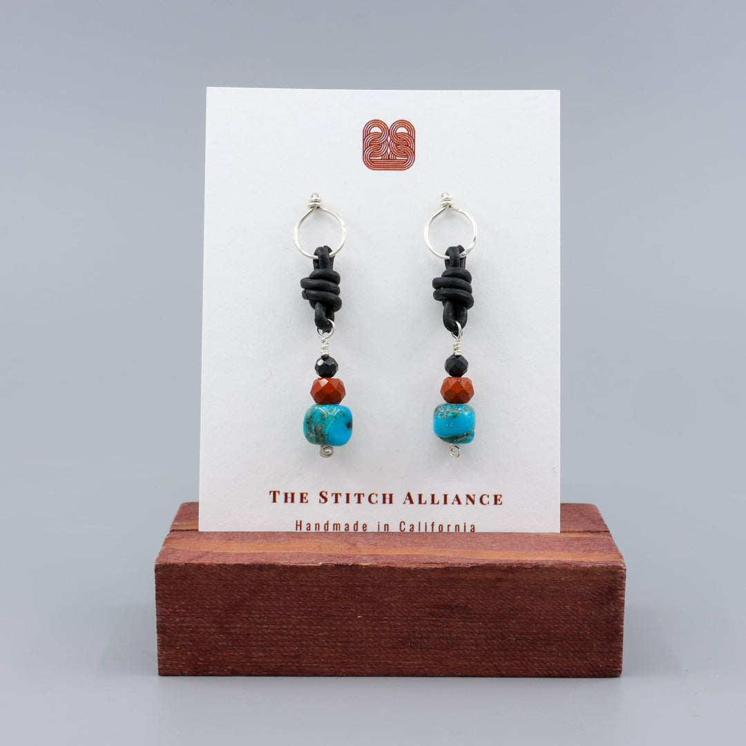 handmade turquoise, poppy jasper, and spinel leather knotted earrings with sterling silver
