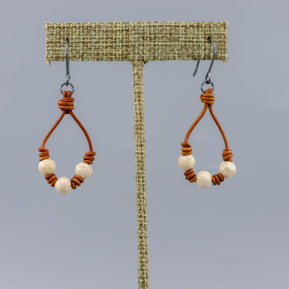 handmade southwest inspired leather and river stone hoop earrings with oxidized silver ear wires