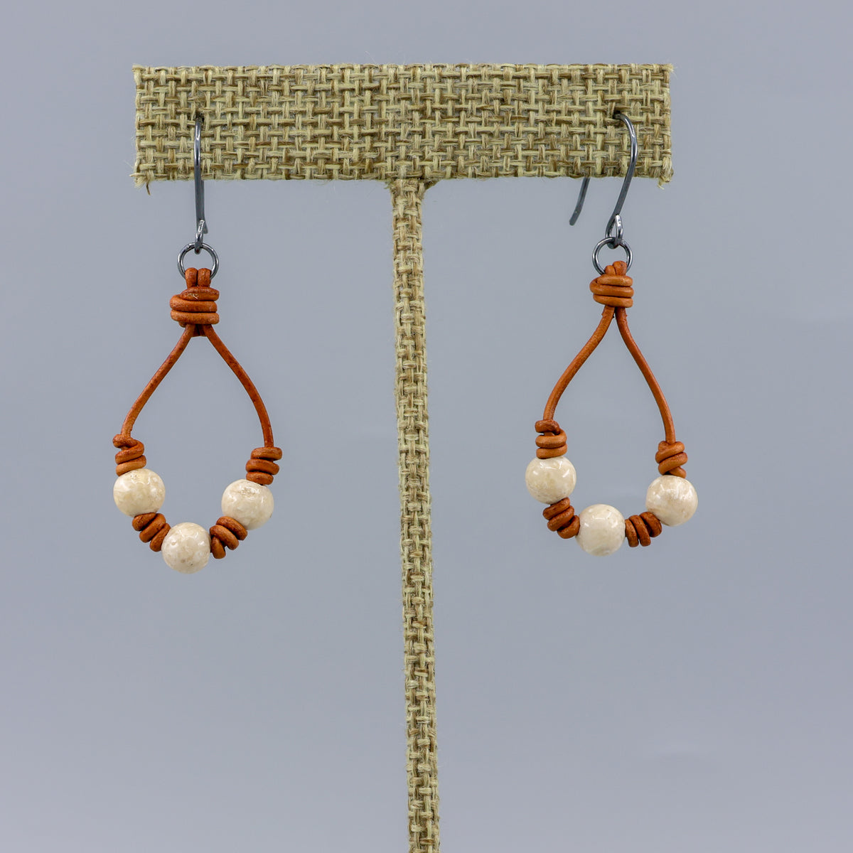 handmade southwest inspired leather and river stone hoop earrings with oxidized silver ear wires