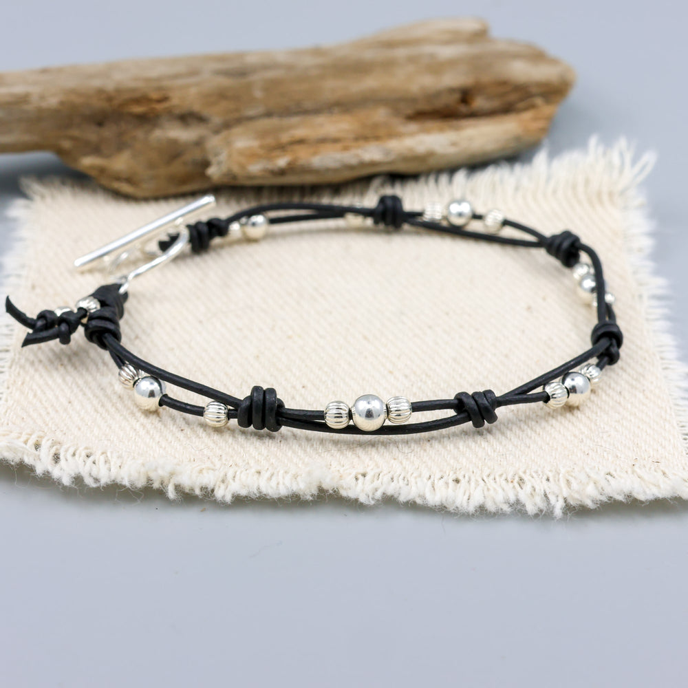 handmade sterling silver and black leather bracelet