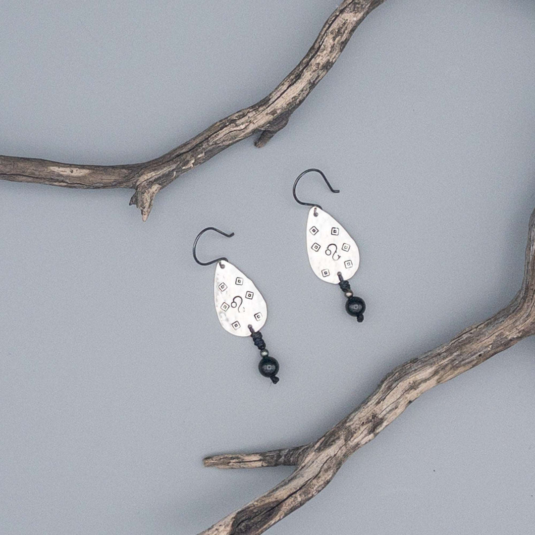 Hand-stamped Leo earrings with black spinel beads