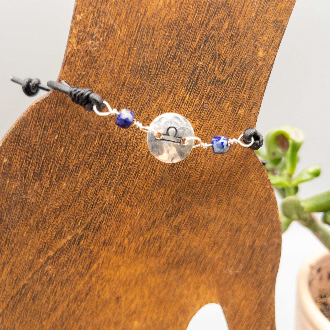 Libra bracelet with lapis lazuli beads on a black leather adjustable strap