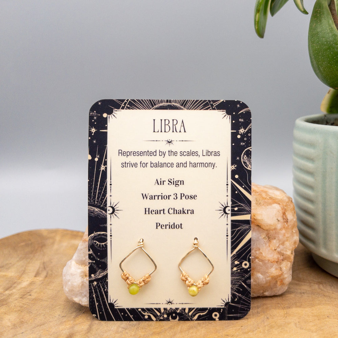 Libra gold filled peridot earrings on a gift card