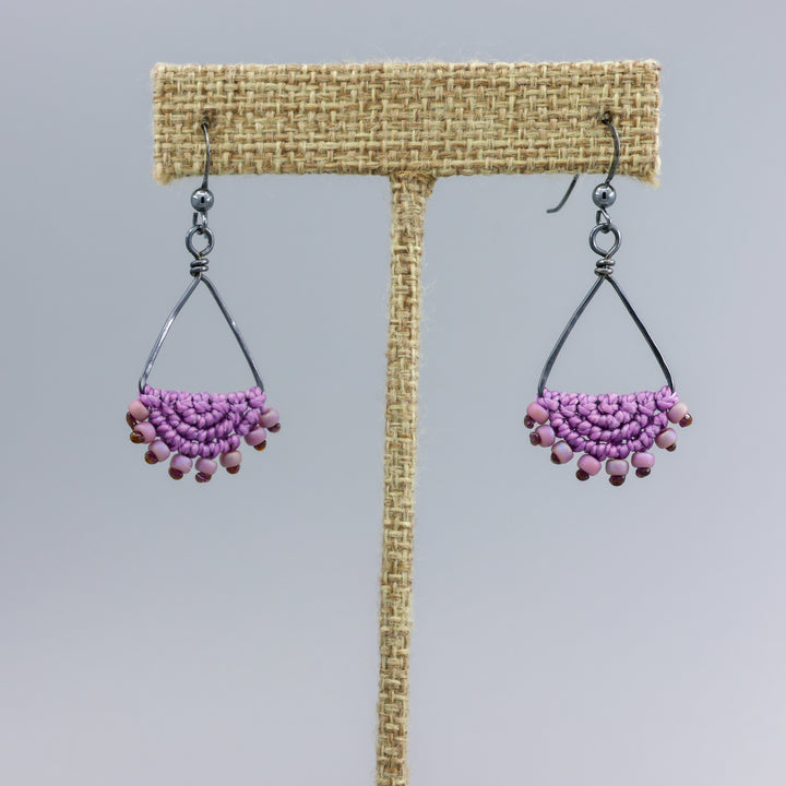 handmade purple macrame triangle hoop earrings in oxidized sterling silver on a  linen hanger