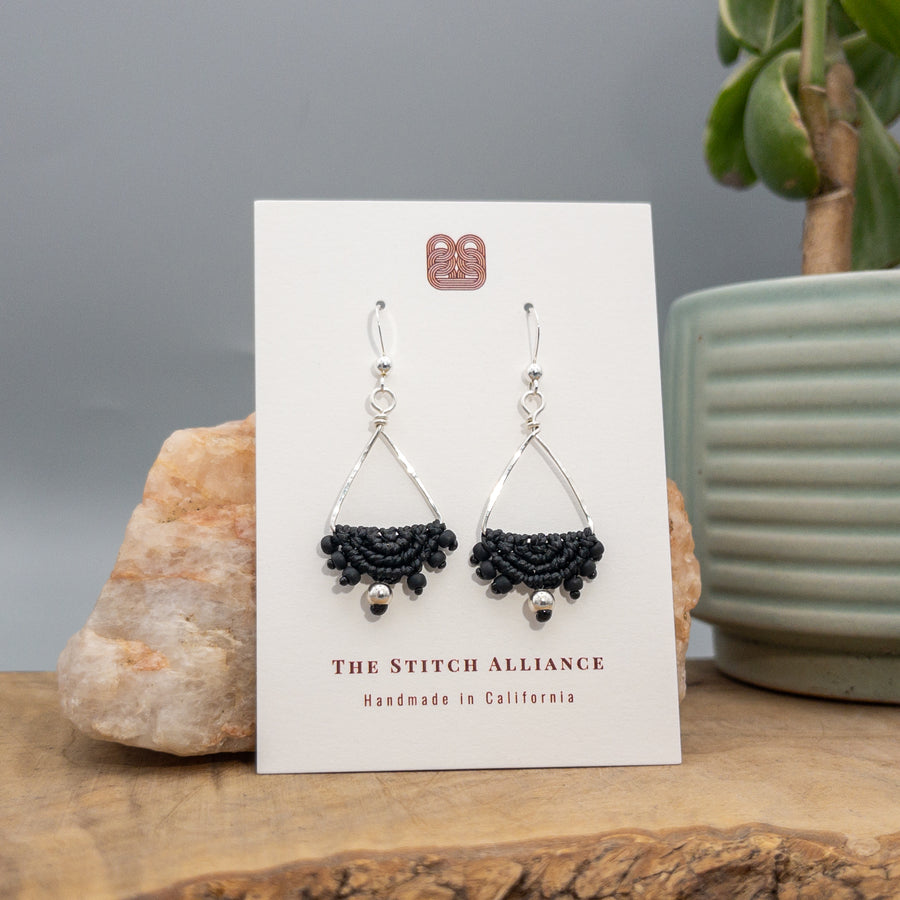 sterling silver triangle hoop earrings with black macrame half moon