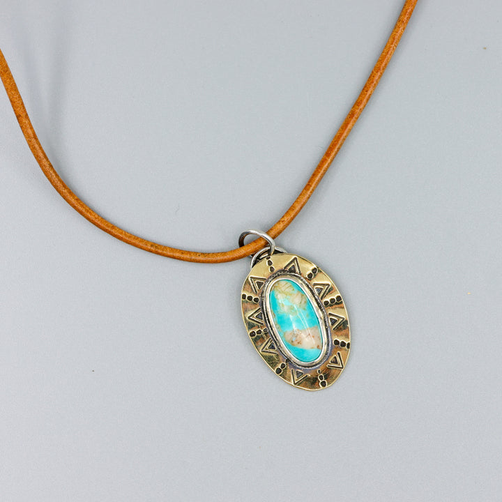 turquoise and brass and silver handmade pendant on  leather cord