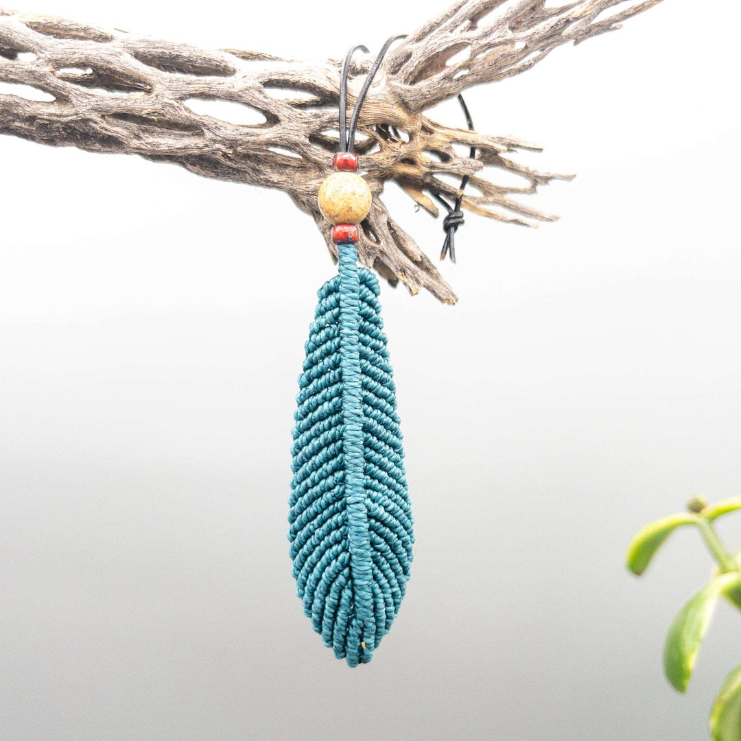large teal macrame feather diffuser with lava bead