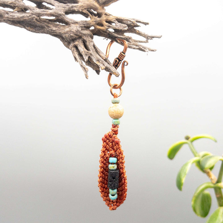Macrame Feather Diffuser Clip backside of terracotta feather