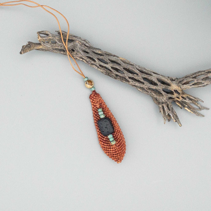 back of terracotta large macrame feather with lava bead diffuser