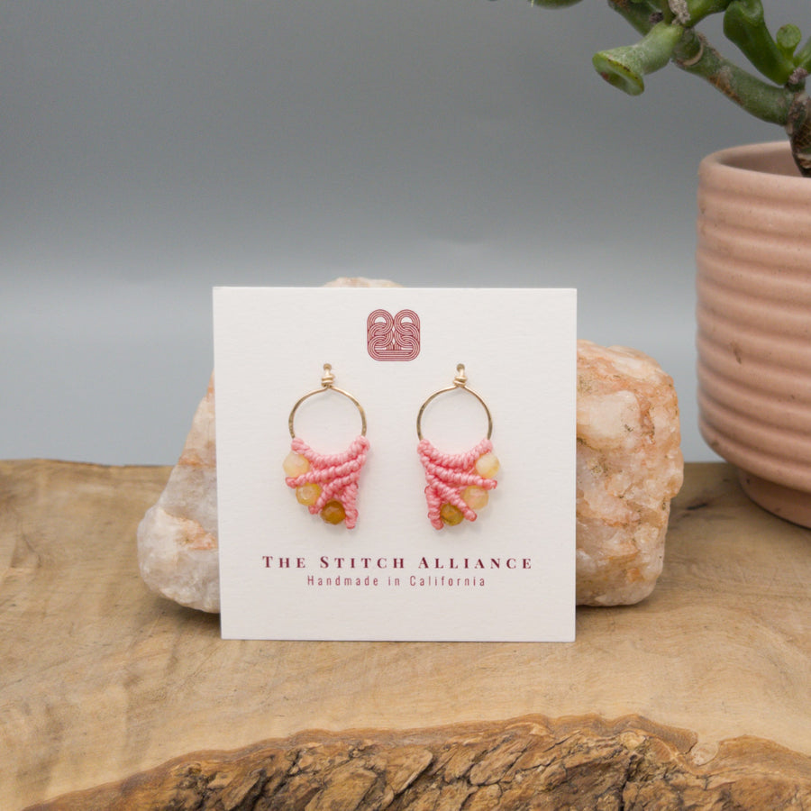 pink macrame earrings with yellow opal bead made with 14k gold fill on a white card