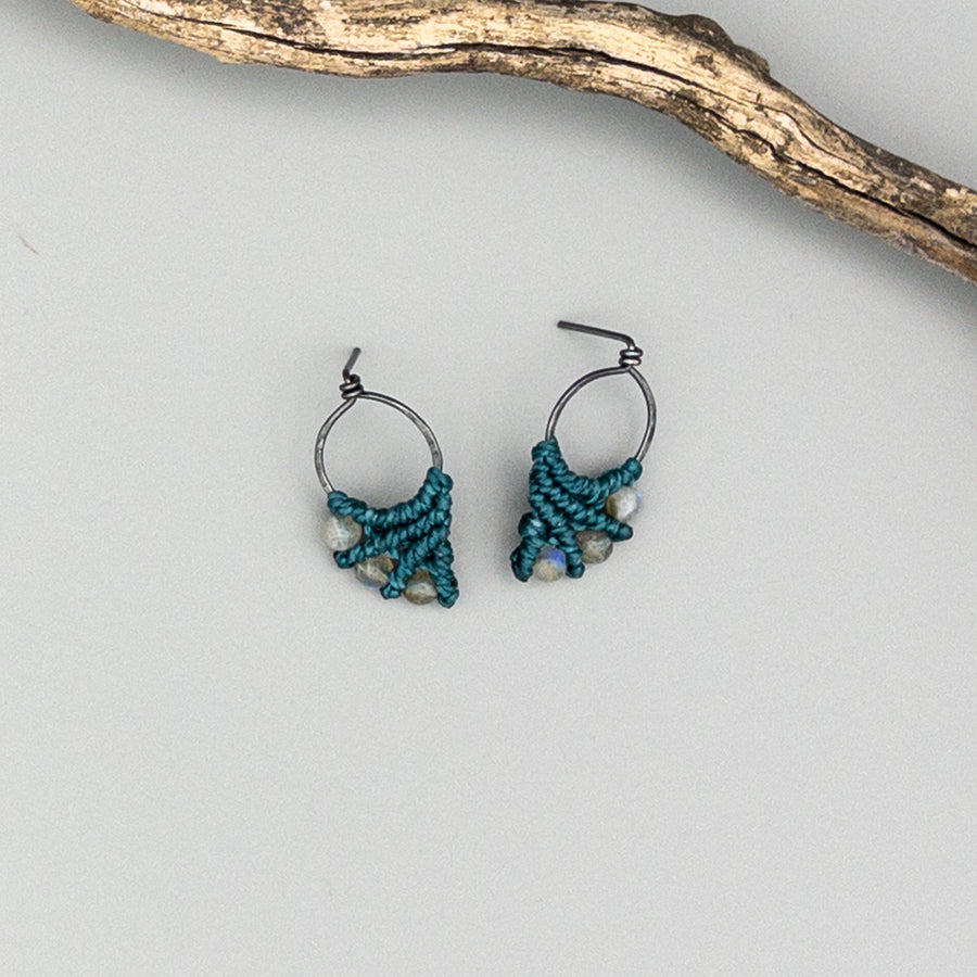 teal macrame earrings with labradorite beads and oxidized sterling silver posts on a gray background