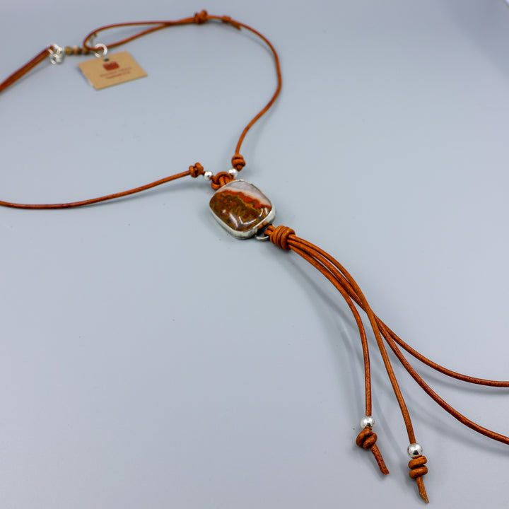 Mexican Agate Sterling Silver Bolo Style Necklace on a gray background