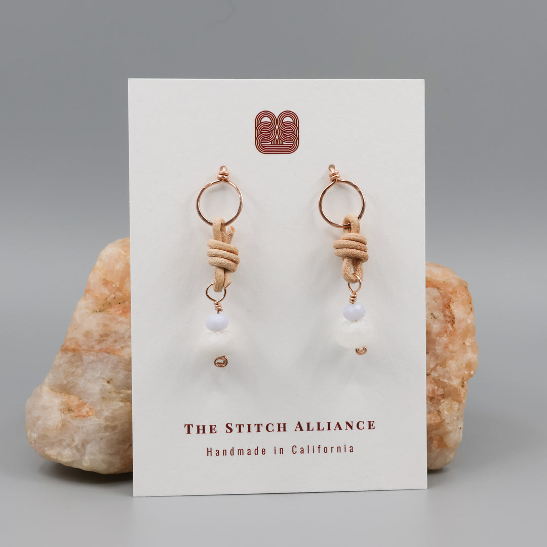 rainbow moonstone, blue lace agate, rose gold earrings on a white card