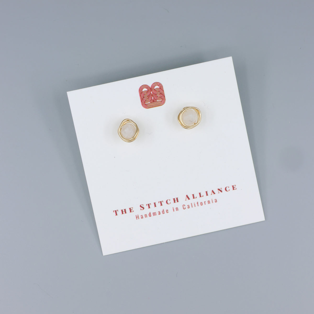 handmade moonstone stud earrings gold fill on a white card