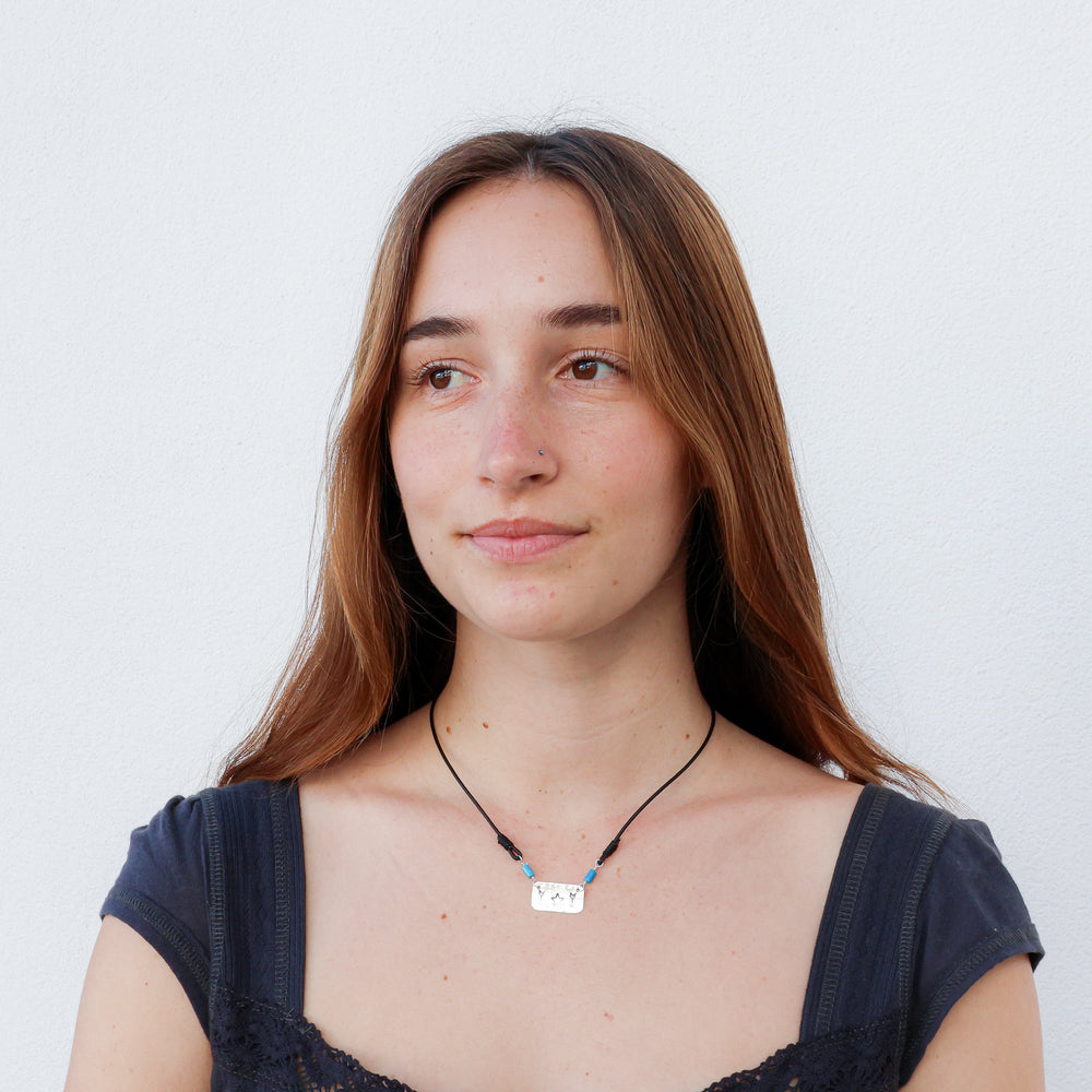 handmade sterling silver, turquoise, and leather necklace