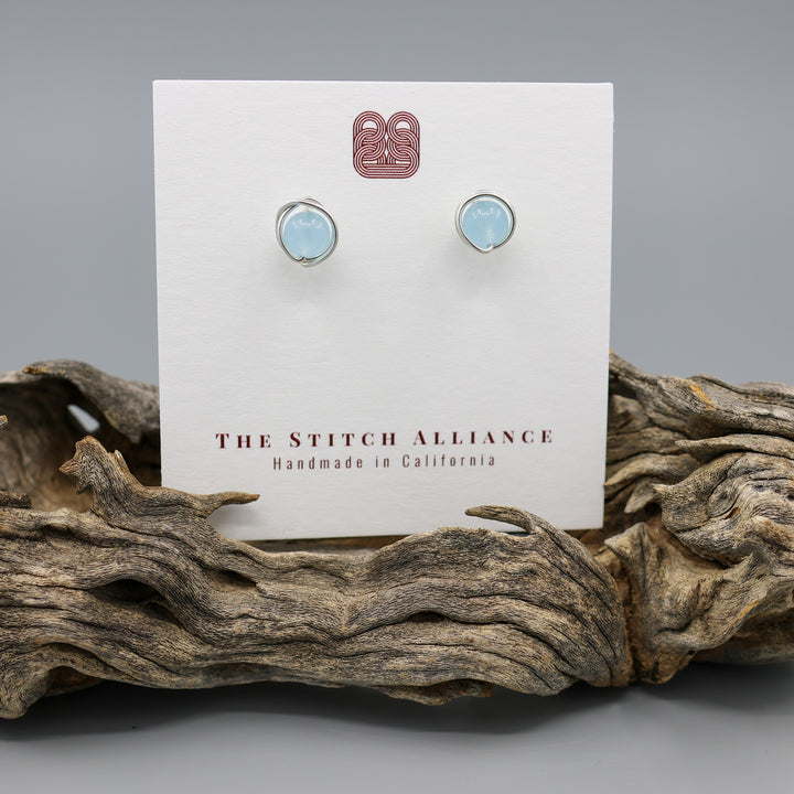 handmade aquamarine sterling silver stud earrings shown on white card