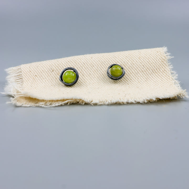 peridot stud earrings wire wrapped oxidized sterling silver detail view