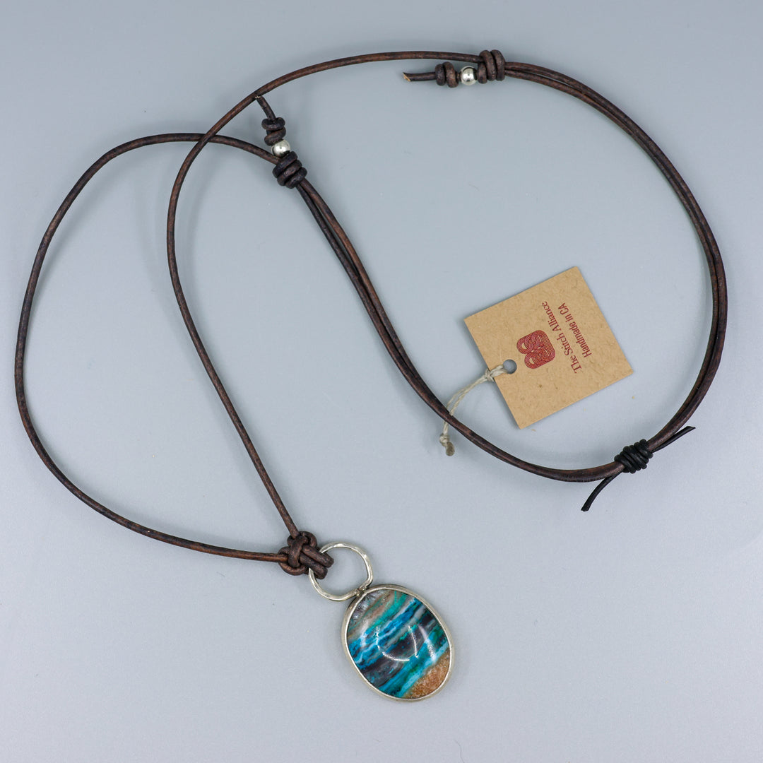 full view handmade ocean jasper and sterling silver necklace on a leather cord