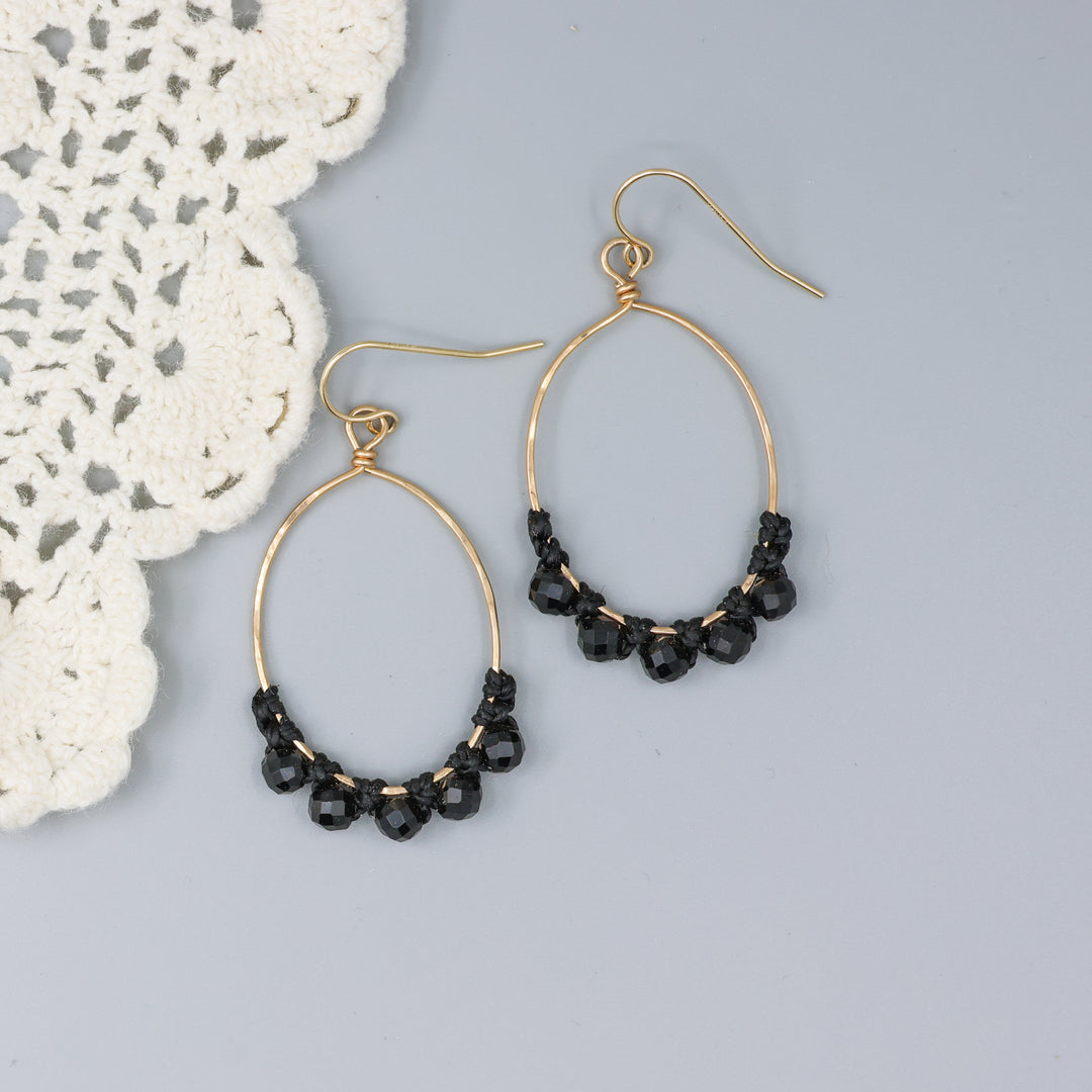 handmade macrame gold hoops with black spinel beads 