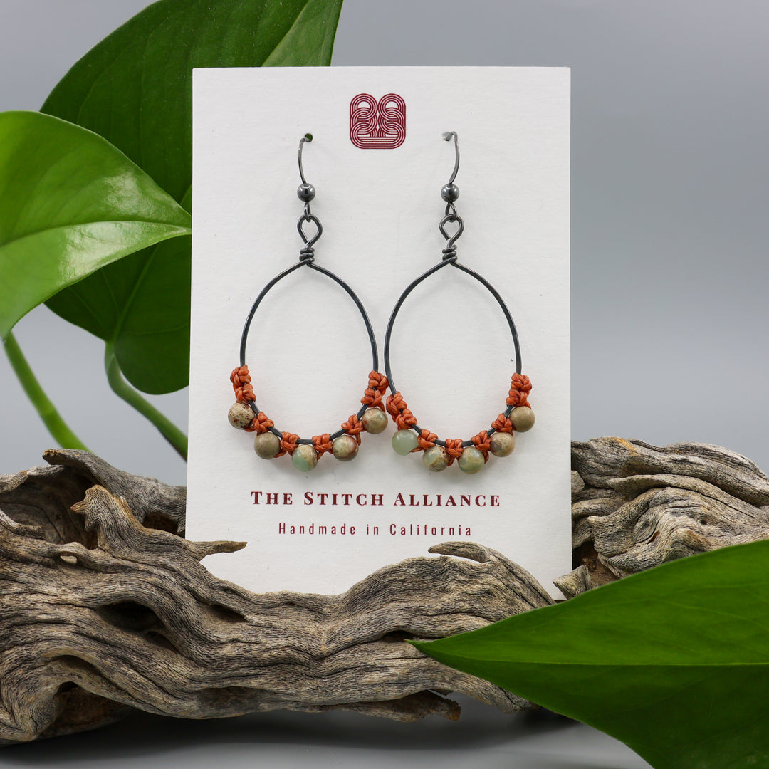 handmade aqua terra jasper beaded hoop earrings on a white card