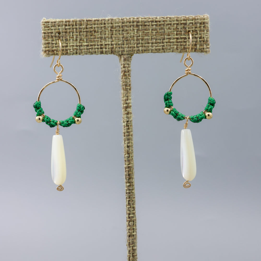handmade gold hoops with mother of pearl beads and green macrame on a linen hanger