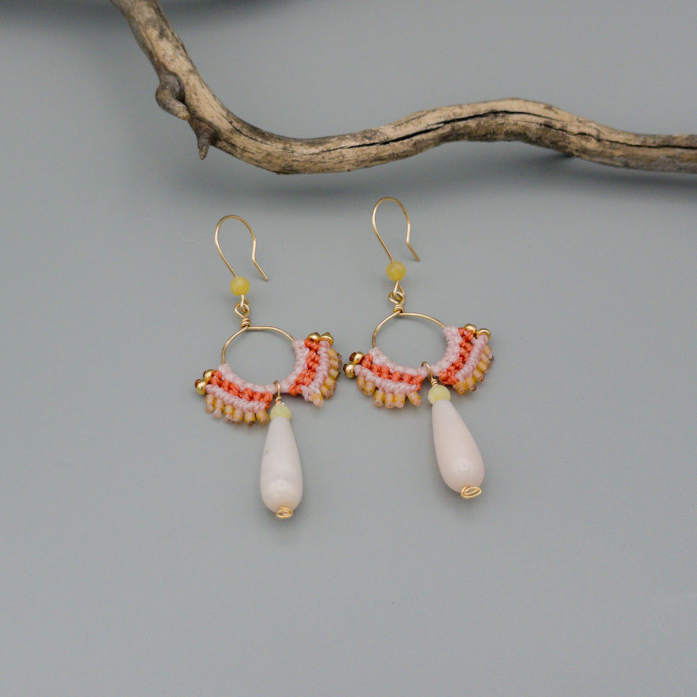 pink opal and yellow opal gold filled macrame statement earrings on a gray background