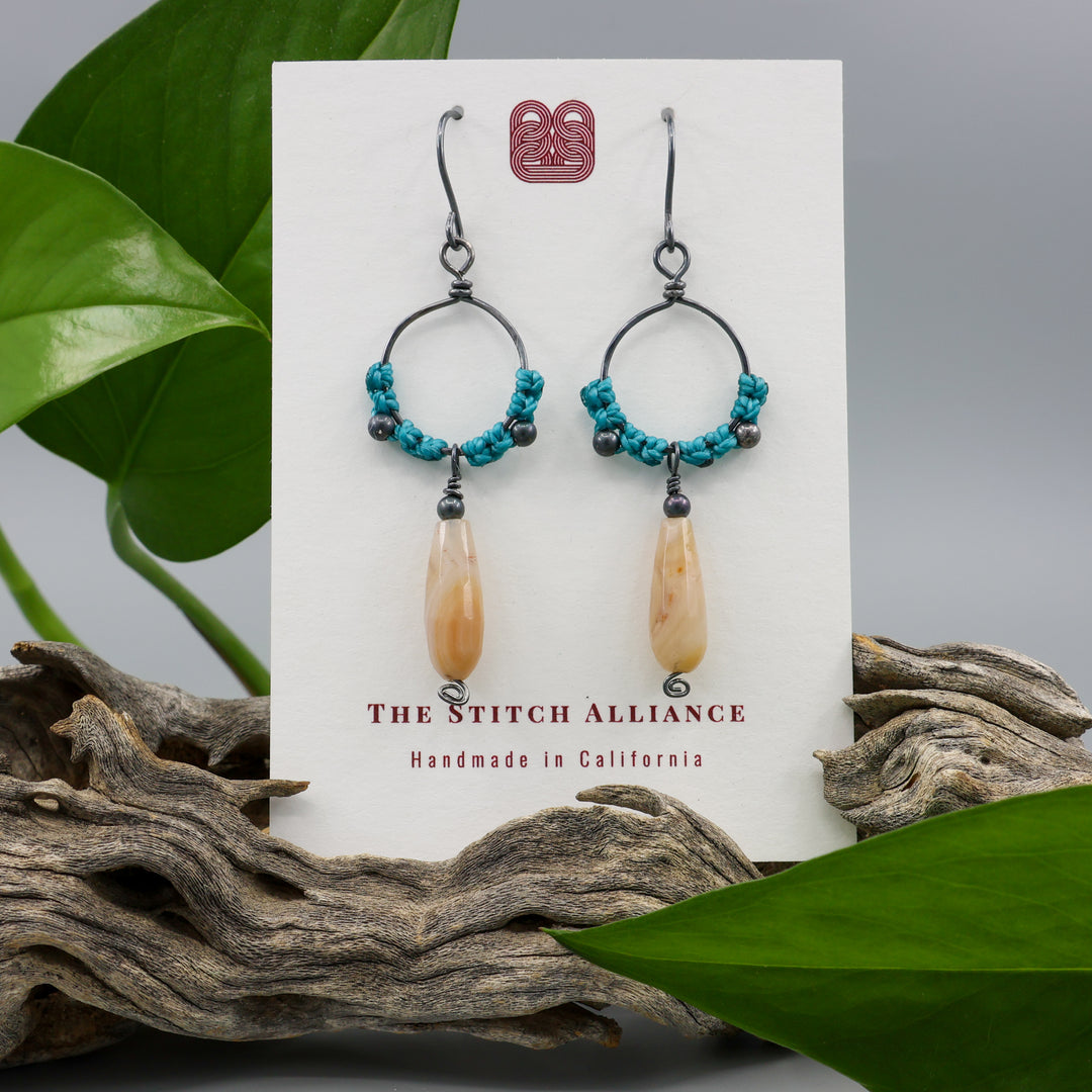 handmade macrame hoop earrings in oxidized sterling silver with botswana agate beads on a white display card